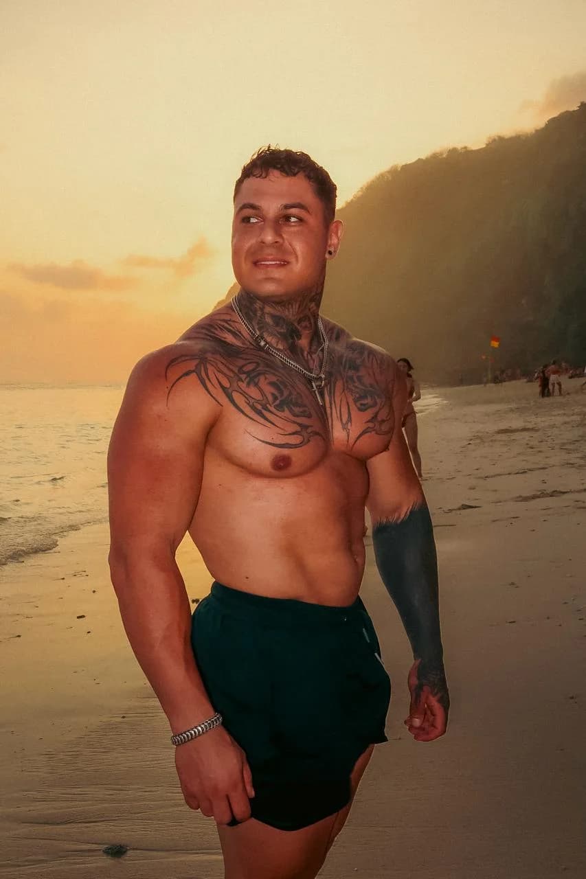 Jeremy on a beach at sunset